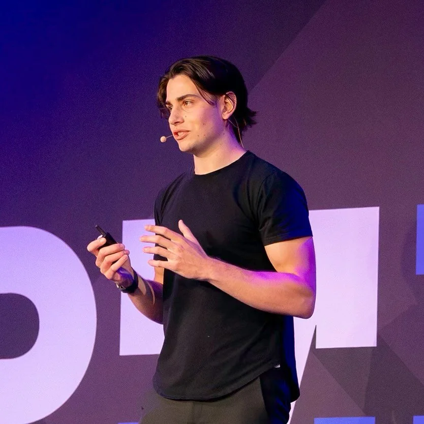 Matt Gia speaking on stage